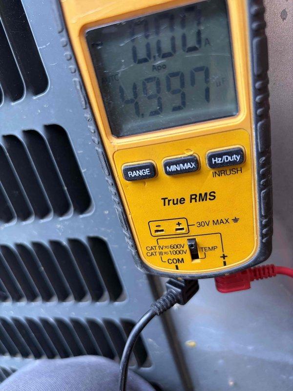 Completed cooling system tune-up and performance verification. Measured compressor amperage at 0.4A and recorded superheat reading of 499.7°F using calibrated digital multimeter. Inspected refrigerant lines, electrical connections, and verified system operation within manufacturer specifications.