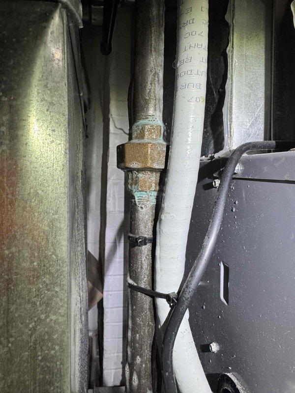 Completed comprehensive cooling tune-up on two HVAC systems, performing standard maintenance procedures including electrical diagnostics with amp readings, refrigerant pressure verification, and inspection of mechanical components. Observed corrosion on pipe fittings in utility area and documented system operating parameters; both units operating within normal specifications at time of service.