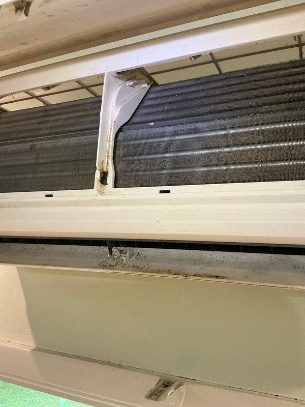 Responded to no cooling complaint on wall-mounted AC unit. Upon inspection, found evaporator coils heavily contaminated with dust, dirt, and mold buildup causing restricted airflow and reduced cooling capacity. Performed thorough cleaning of evaporator coils, removed debris from drainage pan, and cleaned internal components to restore proper system operation and airflow.