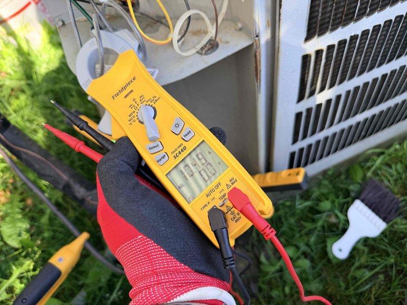 # HVAC Cooling System Maintenance

Performed comprehensive preventive maintenance on residential air conditioning system as part of scheduled recurring service plan. Conducted electrical diagnostics using digital multimeter to verify proper system operation, measuring voltage and amperage at the outdoor condenser unit. Accessed electrical disconnect box to test capacitor performance and inspect wire connections for signs of wear or overheating. All electrical components tested within manufacturer specifications. Verified condenser unit operation and confirmed refrigerant lines properly insulated. System operating efficiently with no issues identified during inspection.
