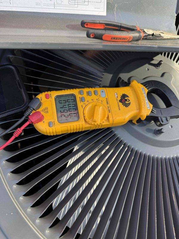 # HVAC Cooling System Maintenance

Performed comprehensive preventive maintenance on residential air conditioning system as part of recurring service agreement. Conducted thorough inspection and diagnostic testing of outdoor condenser unit, including electrical measurements using digital clamp meter to verify proper voltage and amperage levels. Measured refrigerant temperatures and pressures at service ports to ensure system is operating within manufacturer specifications. All electrical components, fan motor, and condenser coil inspected and found to be functioning properly. System operating efficiently with no deficiencies noted at time of service.