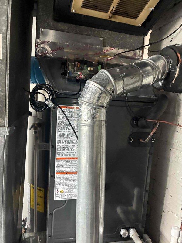 Completed full HVAC system installation including new air conditioning unit and evaporator coil at residential property. Installed exterior condensing unit with proper electrical conduit and disconnect box mounted to building exterior siding, ensuring secure weatherproof connections and code-compliant wiring. Interior installation included new evaporator coil integrated into existing furnace cabinet with proper refrigerant line connections, condensate drainage, and electrical hookup to blower assembly. System was pressure tested for leaks, evacuated, and charged with refrigerant to manufacturer specifications. Verified proper airflow, temperature differential, and electrical amp draw on all components. All safety labels and warnings properly displayed on equipment. System startup completed successfully with all components operating within normal parameters.