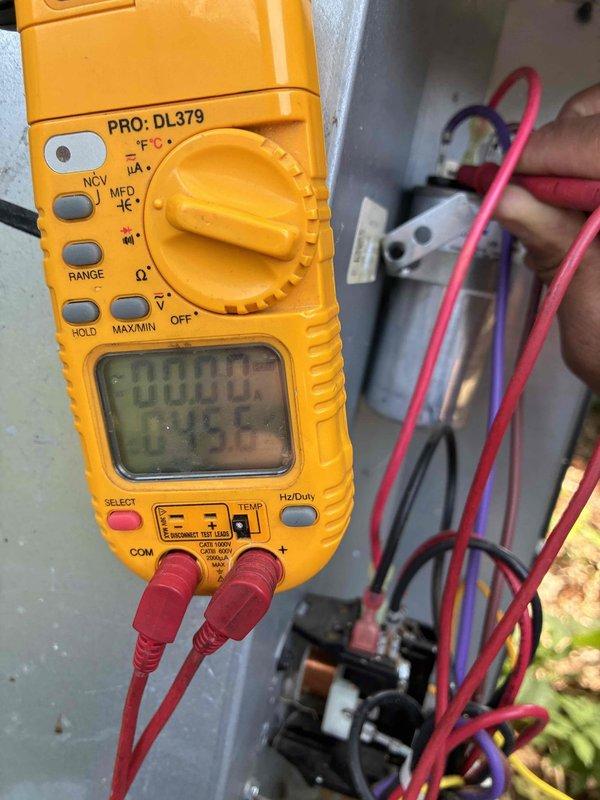 Performed comprehensive cooling maintenance on two HVAC systems as part of scheduled preventive maintenance program. Conducted electrical diagnostics using digital multimeter to verify proper voltage and amperage readings at contactor terminals and control circuits. Inspected and tested outdoor disconnect switches, confirming secure wire connections on line and load terminals with proper grounding. Evaluated electrical components including contactors, capacitors, and control wiring for signs of wear, overheating, or deterioration. Verified all safety disconnects operating correctly and accessible for emergency shutoff. Documented system performance through photographic records of electrical testing procedures and disconnect box conditions. All systems found operating within normal parameters with no immediate repairs required.