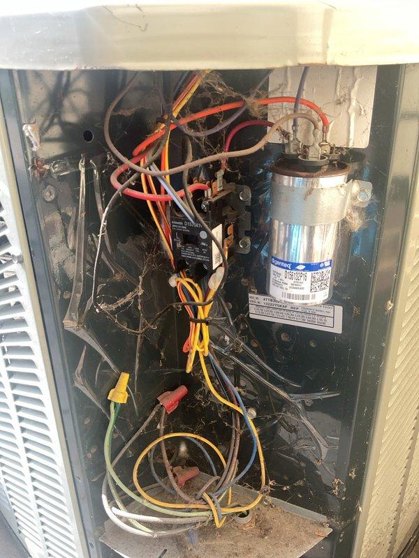 Performed comprehensive preventive maintenance on residential HVAC system with equipment over 10 years old in preparation for cooling season. Inspected Comfort-Aire furnace and air conditioning unit, examining all internal components including capacitor, electrical connections, and blower assembly. Cleaned accumulated dust and debris from interior compartments, checked all wire connections and terminals for proper contact, verified capacitor function, and inspected refrigerant lines and condensate drainage system for proper operation.
