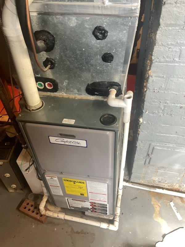 Performed comprehensive preventive maintenance on residential HVAC system with equipment over 10 years old in preparation for cooling season. Inspected Comfort-Aire furnace and air conditioning unit, examining all internal components including capacitor, electrical connections, and blower assembly. Cleaned accumulated dust and debris from interior compartments, checked all wire connections and terminals for proper contact, verified capacitor function, and inspected refrigerant lines and condensate drainage system for proper operation.