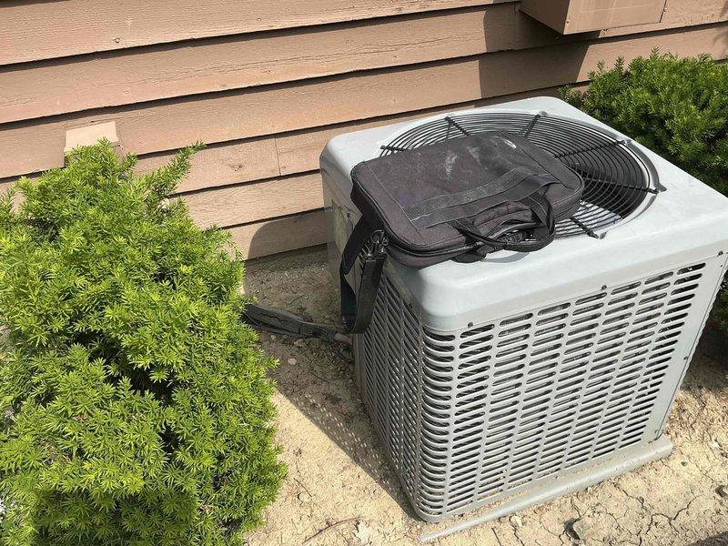 Conducted comprehensive site evaluation for full HVAC system replacement. Assessed existing outdoor condensing unit installed on concrete pad adjacent to building exterior and inspected interior ductwork system including galvanized metal supply ducts mounted to basement ceiling joists. Documented current equipment condition, installation configuration, and structural mounting points to provide customer with complete system replacement options and specifications.