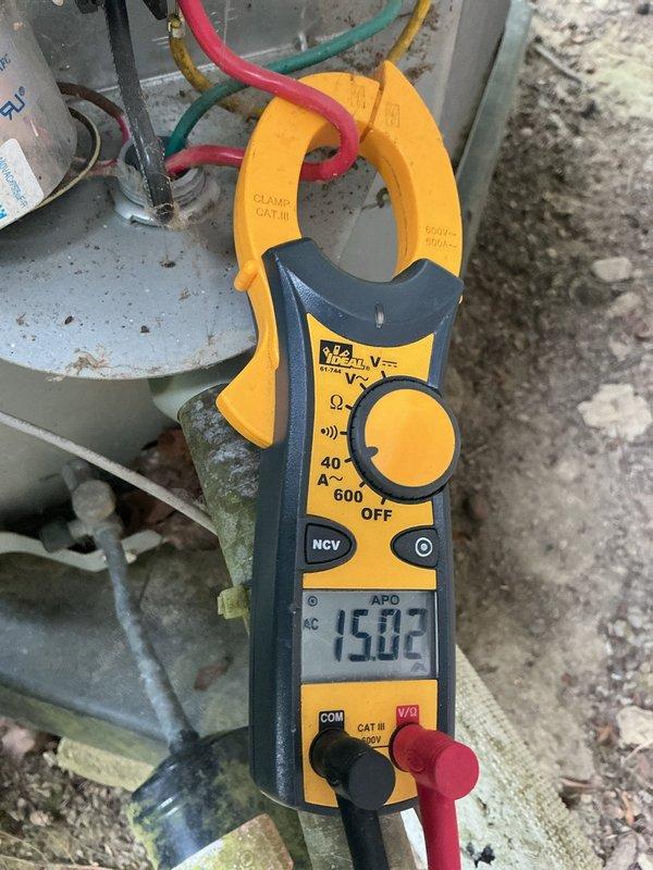 Completed cooling maintenance on outdoor condensing unit. Performed electrical diagnostics using clamp meter, recording compressor amperage at 15.02 amps. Inspected condenser coils, fan assembly, and electrical connections. Unit operating within normal parameters at time of service.
