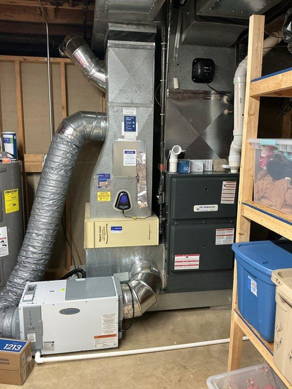 # HVAC Cooling Maintenance Summary

Completed scheduled preventative maintenance on two-system HVAC cooling setup. Inspected and serviced primary furnace and connected air handler, verified proper operation of HALO-LED air purification system with confirmed airflow indicator functionality. Performed routine maintenance checks on secondary cooling unit, inspected all flexible ductwork connections, and verified system integration with dehumidification equipment.

---

## Detailed Work Performed

Conducted comprehensive cooling season maintenance on dual HVAC system installation located in basement mechanical room. Primary system consists of vertical furnace unit with integrated cooling capabilities, secondary system includes standalone air handler with dehumidification function.

**Air Purification System Inspection:**
Verified HALO-LED air purification device operational status with illuminated display confirming active airflow. Inspected mounting hardware and electrical connections on 