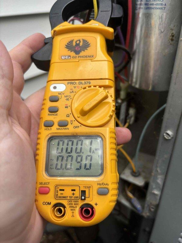 # HVAC Cooling Maintenance Summary

Completed scheduled preventive maintenance on residential air conditioning system. Performed electrical diagnostics using digital clamp meter to verify proper amperage draw and system performance. Inspected outdoor condenser unit, noting significant weathering and coating deterioration on cabinet exterior from extended outdoor exposure. All electrical connections tested and confirmed operational. System operating within normal parameters upon completion of maintenance visit.

---

## Detailed Service Report

Performed comprehensive cooling season maintenance on residential HVAC system as part of ongoing preventive maintenance program. Service included thorough inspection and testing of outdoor condensing unit and associated electrical components.

**Electrical Testing and Diagnostics:**
Utilized digital clamp meter to measure and verify electrical performance parameters. Conducted amperage readings on compressor and condenser fan motor circuits to en