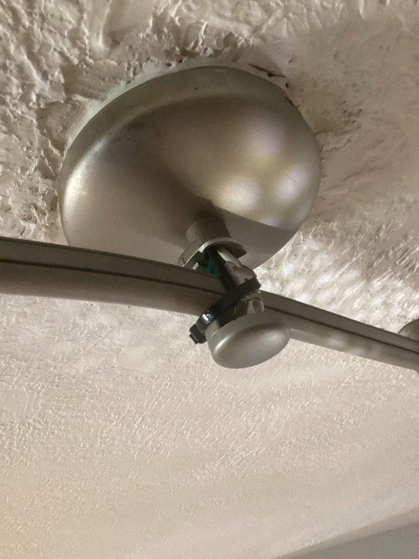 Responded to no power call at rental property where tenant reported loss of electrical power and blinking thermostat. Upon arrival, inspected electrical system and identified issues with ceiling-mounted track lighting fixtures showing signs of loose connections and potential electrical faults at mounting points. Examined ceiling fixtures with discoloration indicating possible previous moisture exposure that may have compromised wiring integrity. Secured all electrical connections at fixture mounting points, verified proper grounding, and restored power to affected circuits. Tested thermostat functionality and confirmed restoration of normal operation. All systems operational upon completion.
