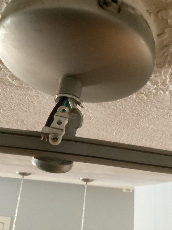 Responded to no power call at rental property where tenant reported loss of electrical power and blinking thermostat. Upon arrival, inspected electrical system and identified issues with ceiling-mounted track lighting fixtures showing signs of loose connections and potential electrical faults at mounting points. Examined ceiling fixtures with discoloration indicating possible previous moisture exposure that may have compromised wiring integrity. Secured all electrical connections at fixture mounting points, verified proper grounding, and restored power to affected circuits. Tested thermostat functionality and confirmed restoration of normal operation. All systems operational upon completion.