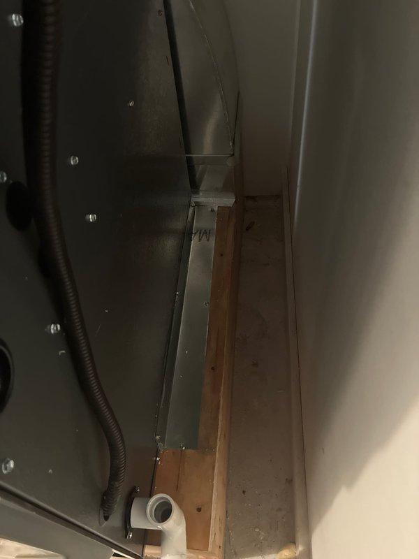 Completed installation of a 96% high-efficiency furnace system in basement utility area. Unit was mounted on wooden platform with proper clearances, including connection of gas line via flexible conduit, installation of white PVC venting and condensate drain system with proper pitch, integration of metal supply and return ductwork with professional sealing, and complete electrical wiring to wall-mounted air handler control box. System was tested for proper operation and all safety protocols were verified upon completion.