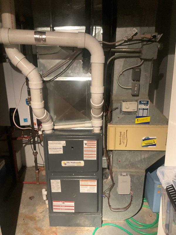 Completed comprehensive cooling system maintenance on two residential air conditioning units. Performed standard preventive maintenance procedures including system inspection, temperature differential measurements, and equipment performance verification. Both HVAC systems, including the J.K. Wadsworth furnace with air handler configuration, were evaluated and found to be operating within normal parameters with temperature readings confirming proper cooling output.