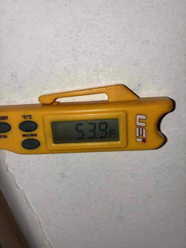 Completed full HVAC system installation including 96% efficiency furnace and air conditioning unit to resolve no cooling condition. Installed new furnace with proper venting via white PVC piping, connected air handler with flexible metallic ductwork, and set up condensate pump system with clear drainage tubing. Verified system operation with temperature readings confirming proper cooling performance at 53.9°F output.