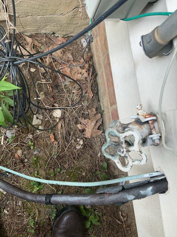 Responded to no-cooling complaint and performed diagnostic inspection of residential air conditioning system. Upon arrival, found outdoor condensing unit with significant debris accumulation around equipment and restricted airflow conditions. Cleared leaves, twigs, and organic matter from base of unit and surrounding area. Inspected refrigerant lines, electrical connections, and condensate drainage system. Verified proper operation of compressor and condenser fan motor after clearing obstructions and restoring adequate ventilation to unit.