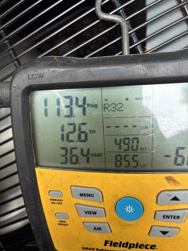 Responded to no cooling call and performed diagnostic evaluation of air conditioning system. Upon inspection, found system experiencing refrigerant leak as evidenced by moisture staining visible at condensate area and abnormal pressure readings on refrigeration gauges showing 1134 psig with superheat of 126°F and suction temperature of 36.4°F. Documented system conditions with diagnostic equipment and photographic evidence of leak location near bundled refrigerant line sets secured with cable ties in attic space. Senior technician assessed situation given urgency of health-related concerns and determined immediate repair necessary to restore cooling operation.