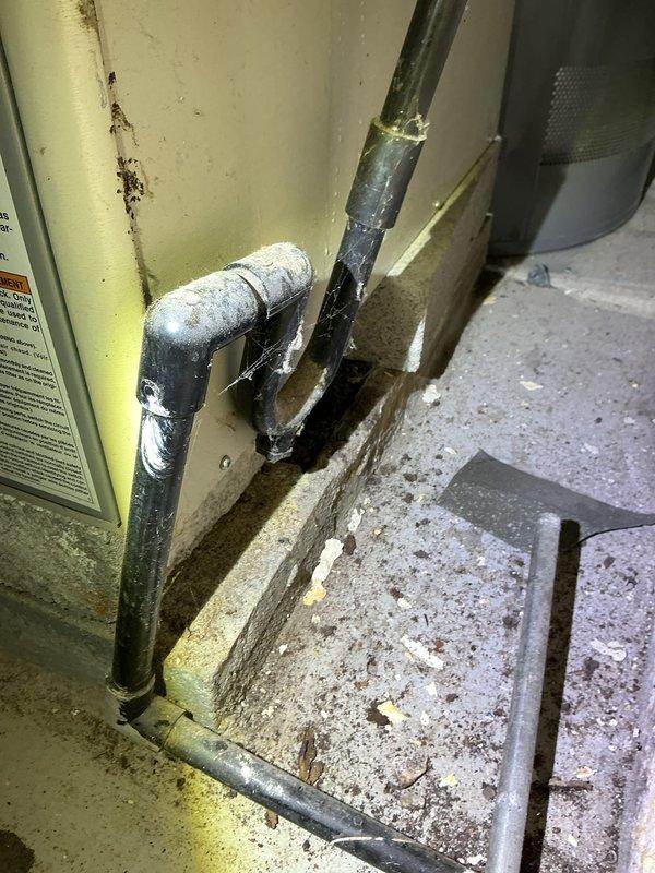 Responded to service call for newly installed air conditioning system that was not operational. Upon inspection, discovered multiple installation deficiencies including improperly insulated refrigerant lines showing deterioration and inadequate sealing at pipe connections. Verified condensate drain line configuration and PVC connections at air handler unit. Corrected piping issues, secured all connections with proper clamps, and ensured proper drainage. System tested and confirmed operational upon completion of repairs.
