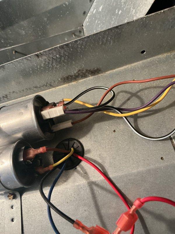 Replaced defective blower motor and wheel assembly in air handler unit. Disconnected and removed failed motor, installed new blower motor and wheel, reconnected all electrical wiring to capacitors and terminals, and verified proper operation of the system upon completion.