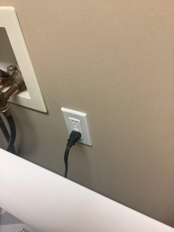 Completed electrical safety inspection of bathroom and water heater area. Verified proper GFCI outlet operation with indicator light functioning correctly. Inspected electrical connections and components in mechanical space near water heater tank, checking for proper clearances, secure wiring, and code compliance. Documented existing conditions with photographs for service records.