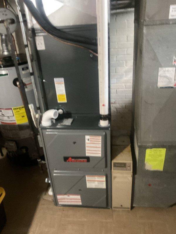 Performed comprehensive cooling system tune-up and inspection on Amana HVAC unit located in basement utility area. Conducted thorough system evaluation including temperature differential measurements across evaporator coil, recording supply air temperature of 48.5°F, verifying proper cooling operation and refrigerant charge. Inspected all mechanical and electrical components, ductwork connections, condensate drainage system, and verified proper airflow throughout the system. All equipment found operating within manufacturer specifications with no deficiencies noted at time of service.