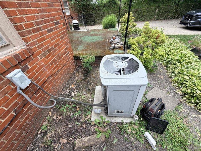 Responded to no cooling complaint on residential air conditioning system. Upon arrival, performed diagnostic inspection of outdoor condensing unit and verified system operation. Unit appeared to be in serviceable condition with proper installation on concrete pad and appropriate clearances maintained. Conducted standard troubleshooting procedures to identify cause of cooling failure and restore normal system operation.