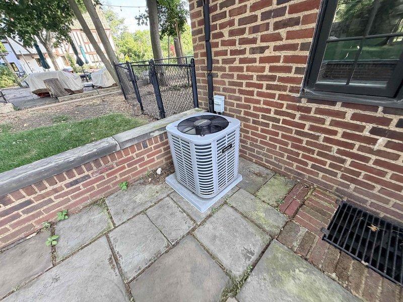 Responded to emergency no-cool call on a 6-year-old central air conditioning system where the condenser fan was not operating. Upon arrival, inspected the outdoor condensing unit and identified a failed dual run capacitor exhibiting visible corrosion and rust deterioration on the cylindrical housing. The capacitor showed significant environmental wear consistent with outdoor exposure. Verified electrical connections and wiring integrity at the component. Replaced the defective capacitor with manufacturer-specified replacement unit rated at 407/21V, 250VAC. Tested system operation and confirmed condenser fan motor startup and proper rotation. Verified cooling cycle initiation and normal compressor operation. System restored to full cooling functionality.