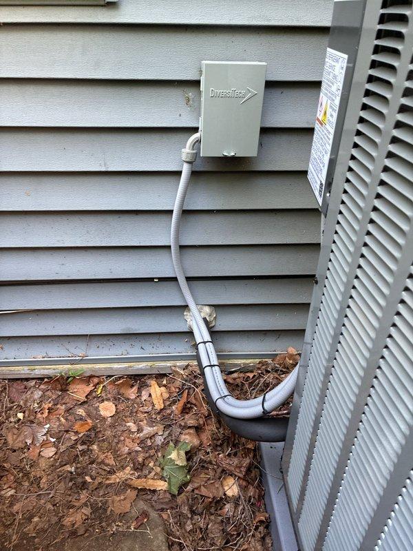 Completed installation of heat pump system with air handler. Installed new electrical disconnect box with proper conduit routing to outdoor unit, verified 25A Class RK5 fuse protection in disconnect assembly, and ensured all electrical connections met code requirements for safe system operation.