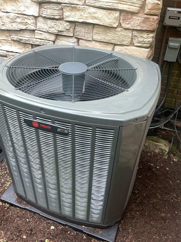 Completed comprehensive cooling system maintenance on Trane XR condenser unit. Replaced heavily soiled return air filter showing significant dust and debris accumulation. Inspected outdoor unit, verified proper operation of condenser fan, and confirmed system components in good working condition.
