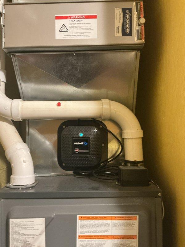 Performed routine HVAC cooling maintenance inspection with focus on electrical components. Accessed outdoor condensing unit and inspected dual capacitor assembly, verifying proper connections and terminal integrity across all wire harnesses including compressor and fan motor circuits. Examined indoor air handler system including UV-C light purification unit, confirming operational status and proper installation of all electrical safety devices and associated PVC drainage lines.