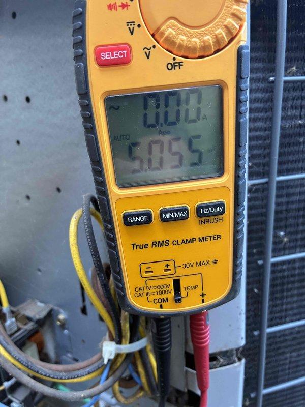 # HVAC Cooling Maintenance Completed

Performed comprehensive cooling system maintenance on residential air conditioning unit. Conducted thorough electrical diagnostics using digital clamp meter, measuring voltage and amperage at contactor terminals to verify proper electrical operation. Inspected terminal block connections, identifying multiple wires showing signs of age deterioration and frayed insulation on green and red conductors. All electrical connections were secured and verified for proper contact. Measured system performance parameters including voltage readings and current draw to ensure unit operating within manufacturer specifications. Inspected condenser coil and associated components for proper operation. System tested and confirmed operational upon completion of maintenance service.