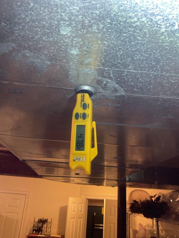 Performed comprehensive cooling system maintenance on residential HVAC unit prior to customer's extended travel. Upon arrival, discovered significant condensation issue on interior ceiling with surface temperature reading of 88.8°F, indicating inadequate insulation or air sealing around ductwork causing moisture accumulation on wood planking. Inspected outdoor condenser unit, which showed normal operating condition with proper placement on composite pad and adequate clearance from brick structure. Completed standard maintenance protocol including visual inspection of all accessible components, verified unit functionality, and documented environmental concerns for follow-up regarding excessive interior condensation that requires attention to prevent potential mold growth or structural damage during customer's absence.