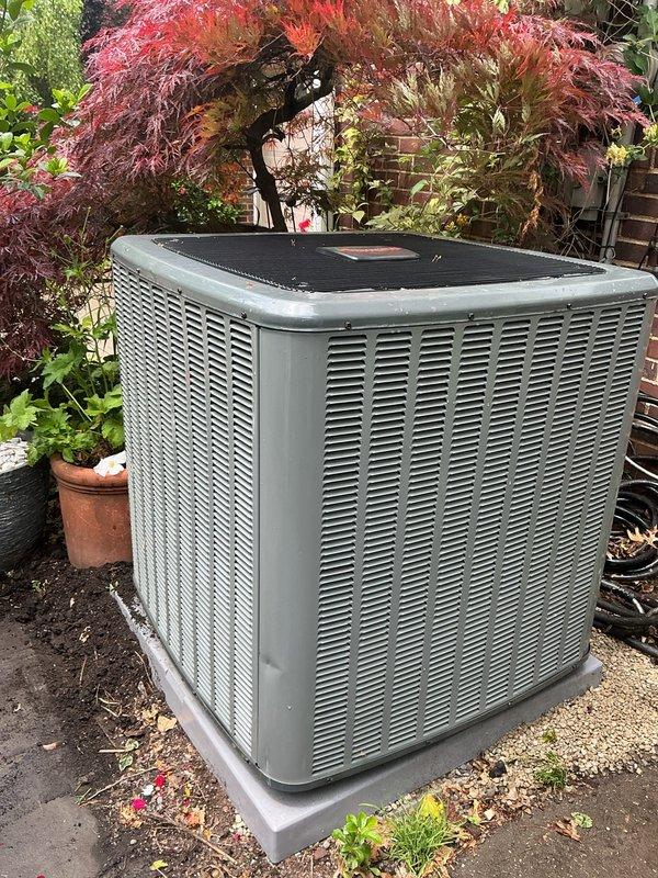 Responded to customer concern regarding inadequate gravel support beneath air conditioning condenser unit. Upon inspection, found one corner of the condenser pad had insufficient pebble base material, creating an unstable foundation. Added and leveled gravel beneath the affected corner to ensure proper support and prevent future settling or tilting of the unit. Verified condenser unit was level and stable on all corners after adjustment. Unit operating normally with no mechanical issues identified.