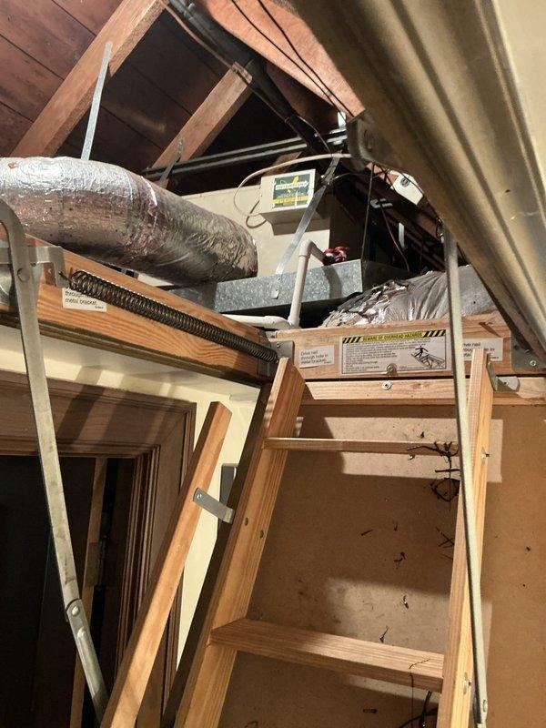 Responded to no cooling complaint on attic-mounted air conditioning system in home with two HVAC systems. Accessed attic unit via fold-down ladder, inspected air handler and associated ductwork, and provided equipment replacement options to address the cooling failure.