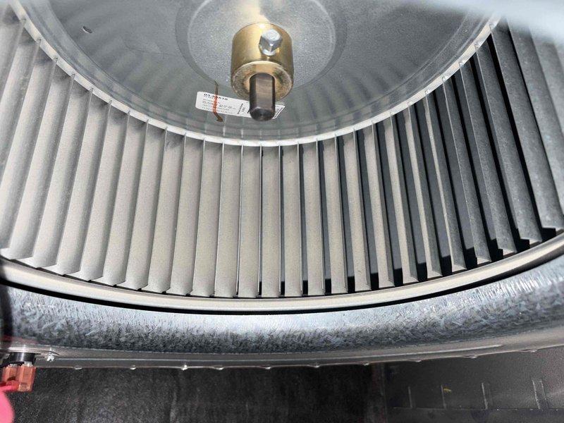 Completed scheduled preventive maintenance on residential cooling system. Performed thorough inspection of blower assembly, confirming squirrel cage fan wheel operating cleanly with no debris accumulation and all blades intact. Verified motor shaft coupling secure with proper setscrew tension. Measured electrical parameters using digital multimeter, recording voltage readings at 63.57V to confirm proper system operation. Inspected outdoor unit components and refrigerant line insulation for integrity. System operating within normal parameters with no deficiencies noted.