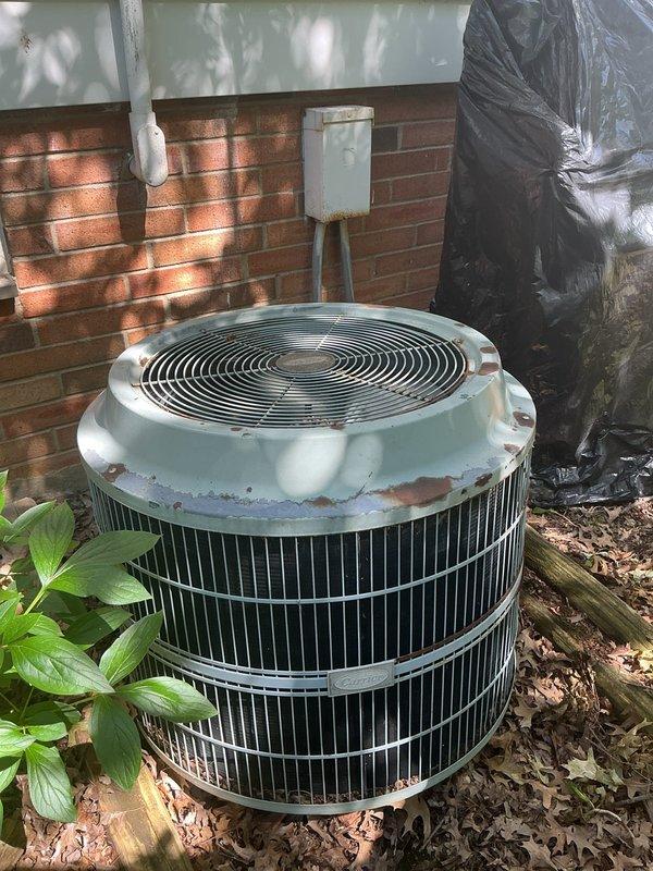 Responded to no cooling complaint on residential air conditioning system. Upon arrival, performed visual inspection of outdoor condensing unit, which showed significant weathering and rust on top cap and exterior components. Removed fan grille cover to access internal components for diagnostic evaluation. Unit exhibited signs of age-related deterioration requiring further assessment. Provided customer with technical recommendations for necessary repairs or system replacement options and discussed financing availability for required work. Diagnostic fee collected per standard service protocol.