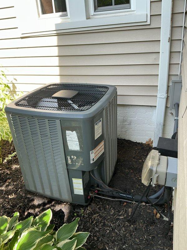 Completed routine HVAC tune-up on residential air conditioning system. Inspected outdoor condenser unit and evaporator coil assembly, noting significant dust and debris accumulation on evaporator fins, particularly on the upper coil section. Documented current system condition with photographs showing contamination levels and overall equipment status for maintenance records.
