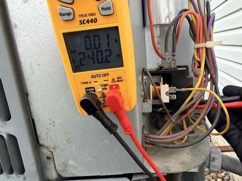 Performed cooling system maintenance on outdoor HVAC unit, conducting comprehensive electrical diagnostics using digital multimeter to verify system performance and safety. Unable to obtain complete electrical readings as indicated, but completed thorough inspection of contactor assembly, wiring connections, and control components to ensure proper operation for the cooling season.