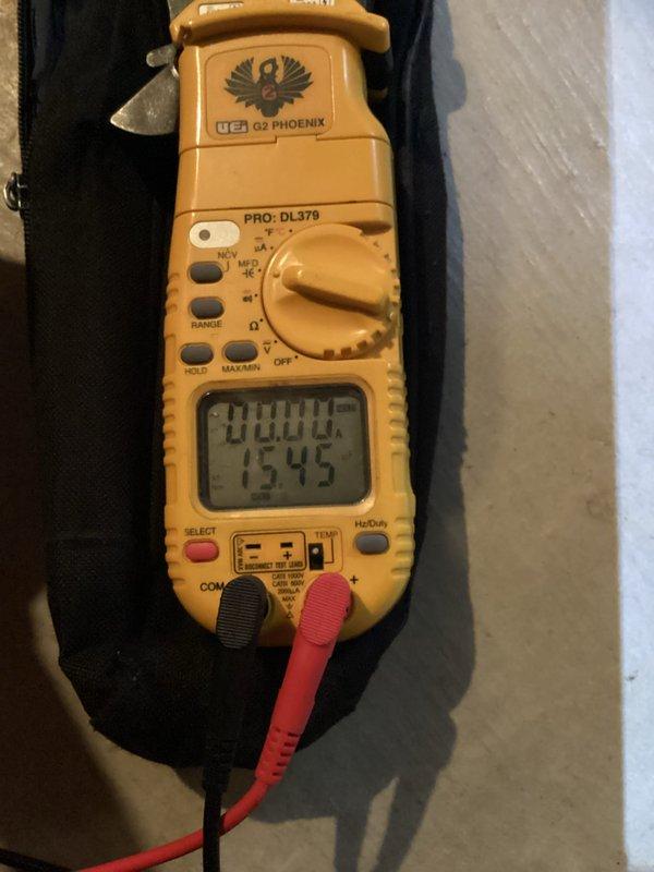 Completed routine HVAC cooling system maintenance and hot water tank inspection. Performed temperature diagnostics in attic space measuring supply air at 48.9°F, confirming proper cooling system operation. Conducted electrical testing with digital multimeter, though complete electrical readings were not available at time of service. Inspected ductwork and insulation conditions in attic area, verifying proper installation and system integrity.