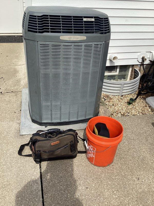 Completed routine HVAC cooling maintenance on Trane outdoor unit. Electrical measurements were not available during this service visit, but dual copper fuses and fuse block were inspected and found to be in proper working condition with no signs of damage or deterioration.