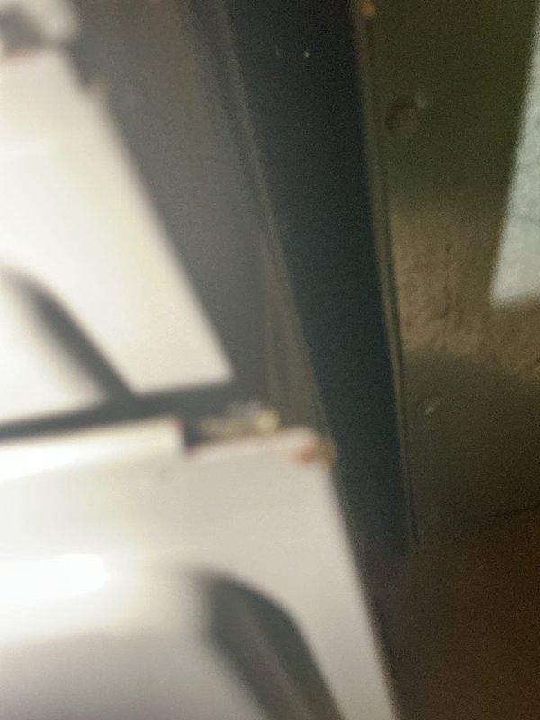 Responded to A/C unit leaking from pipes. Upon inspection, identified active water leak originating from refrigerant line connections with visible rust corrosion and moisture damage on evaporator housing and condensate components. Documented existing conditions showing rust streaking on metal surfaces and water staining around pipe joints, indicating ongoing leak issue requiring repair of compromised piping connections.