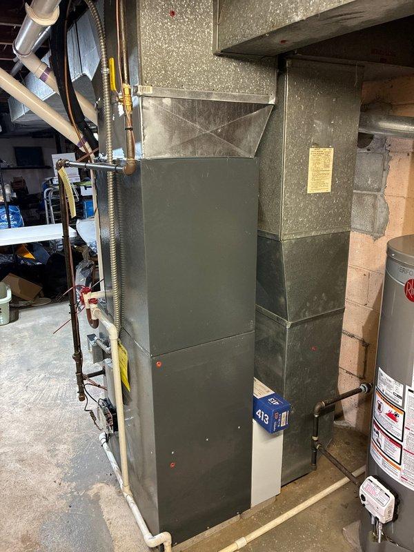Completed installation of new air conditioning system including outdoor condensing unit and indoor air handler. Installed new electrical disconnect with Littelfuse FLNR 15A fuses at outdoor unit, established proper refrigerant line connections, and verified all electrical connections meet code requirements. System tested and operational with proper airflow and cooling capacity confirmed.