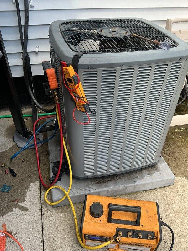 Replaced failed thermostatic expansion valve (TXV) on HVAC system under limited warranty coverage. Connected manifold gauges to verify proper refrigerant charge and system operation following component replacement, with temperature readings confirming system restored to normal operating parameters.