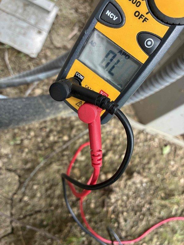 Responded to no-cooling complaint on residential air conditioning system. Upon arrival, confirmed system was running but not producing cold air. Performed diagnostic evaluation of outdoor condensing unit and electrical components. Measured incoming line voltage at disconnect box, which registered 172 volts—significantly below the required 208-240V range for proper compressor operation. Inspected disconnect panel and found aged fuses with visible corrosion on electrical connections and wiring terminals. Low voltage condition identified as primary cause of cooling failure, preventing compressor from operating at design specifications. Documented electrical readings and component condition with photos for customer records. Advised homeowner that utility company should be contacted to address inadequate voltage supply to the unit, as this falls outside HVAC system repair scope and represents an electrical service issue requiring utility provider intervention.