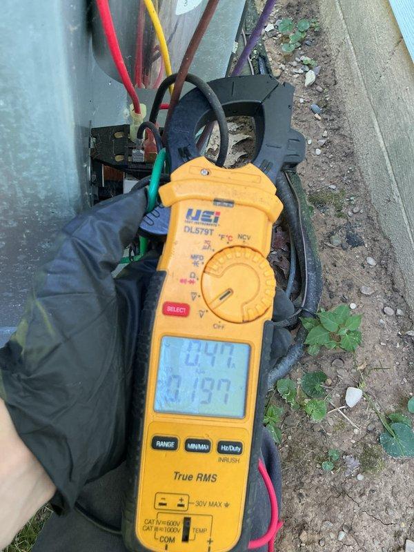 Completed preventative maintenance on residential cooling system. Verified supply air temperature at 52.88°F indicating proper cooling operation. Tested electrical components using clamp meter, confirming voltage at 244V and amperage at 27.9A within normal operating parameters for the unit.