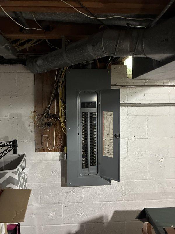 Conducted comprehensive assessment of existing residential HVAC system located in basement utility area. Evaluated furnace unit, ductwork configuration, and associated components to determine replacement requirements. Documented current system conditions including furnace cabinet, humidifier attachment, metal ductwork distribution, and flexible duct connections. Photographed electrical panel integration and utility room layout to prepare accurate equipment specifications and replacement proposal for complete HVAC system upgrade.