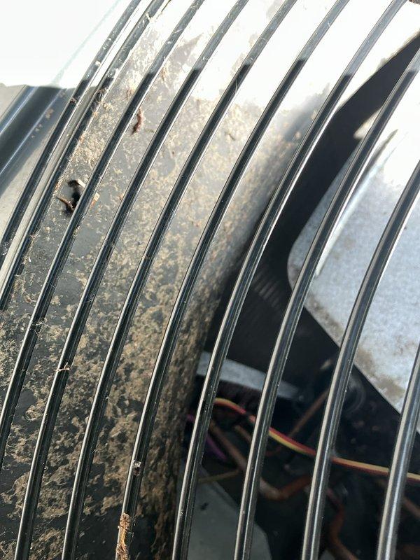 Responded to service call for outdoor condenser unit experiencing loud noises and failure to operate. Upon inspection, discovered significant accumulation of dust, dirt, and debris on heat exchanger coil fins, which was restricting airflow and causing system malfunction. Cleaned condenser coils thoroughly to remove contamination and restore proper airflow through the unit. Verified fan motor operation and checked all electrical connections. System tested successfully after cleaning, with unit running quietly and operating within normal parameters.