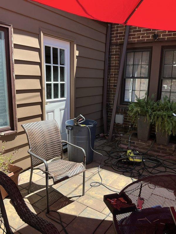 Conducted site assessment for mini-split air conditioning system installation as an add-on to existing boiler heating system. Evaluated outdoor patio area and basement utility space to determine optimal placement for outdoor condenser unit and indoor air handler, reviewed electrical requirements, and discussed multiple configuration options with property owner for implementing ductless AC solution.