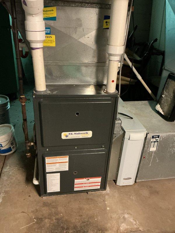 Responded to no-cooling call and performed diagnostic inspection of residential air conditioning system. Verified furnace and indoor air handler operation in basement, confirmed proper electrical connections and ductwork integrity. Inspected outdoor condenser unit, checked fan assembly and motor operation, and verified unit returned to normal cooling function. System tested and confirmed operational upon completion.