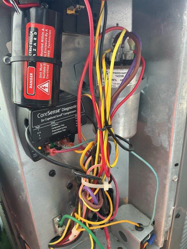 Completed scheduled preventive maintenance on residential air conditioning system. Inspected outdoor condenser unit, indoor air handler components, electrical connections, and capacitor. Verified CoreSense diagnostic system operational and confirmed all safety labels present. System operating within normal parameters with no deficiencies noted.