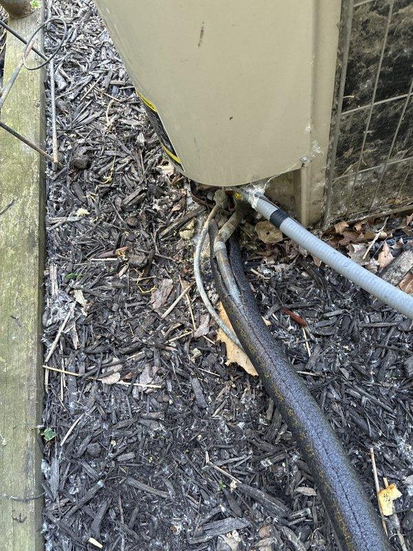 Conducted comprehensive system evaluation and provided replacement options for residential HVAC equipment. Presented customer with full system replacement proposals as well as air conditioning-only replacement alternative, documenting existing outdoor condenser unit on wooden platform with weathered decking and associated refrigerant lines, condensate drainage system, and indoor air handler installation with 12x20x1 filter specifications and aluminum flex ductwork connections.